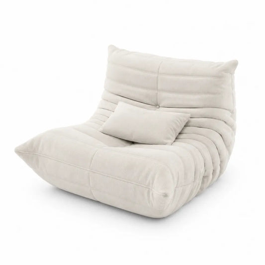 Poltrona in tessuto a coste beige con cuscino